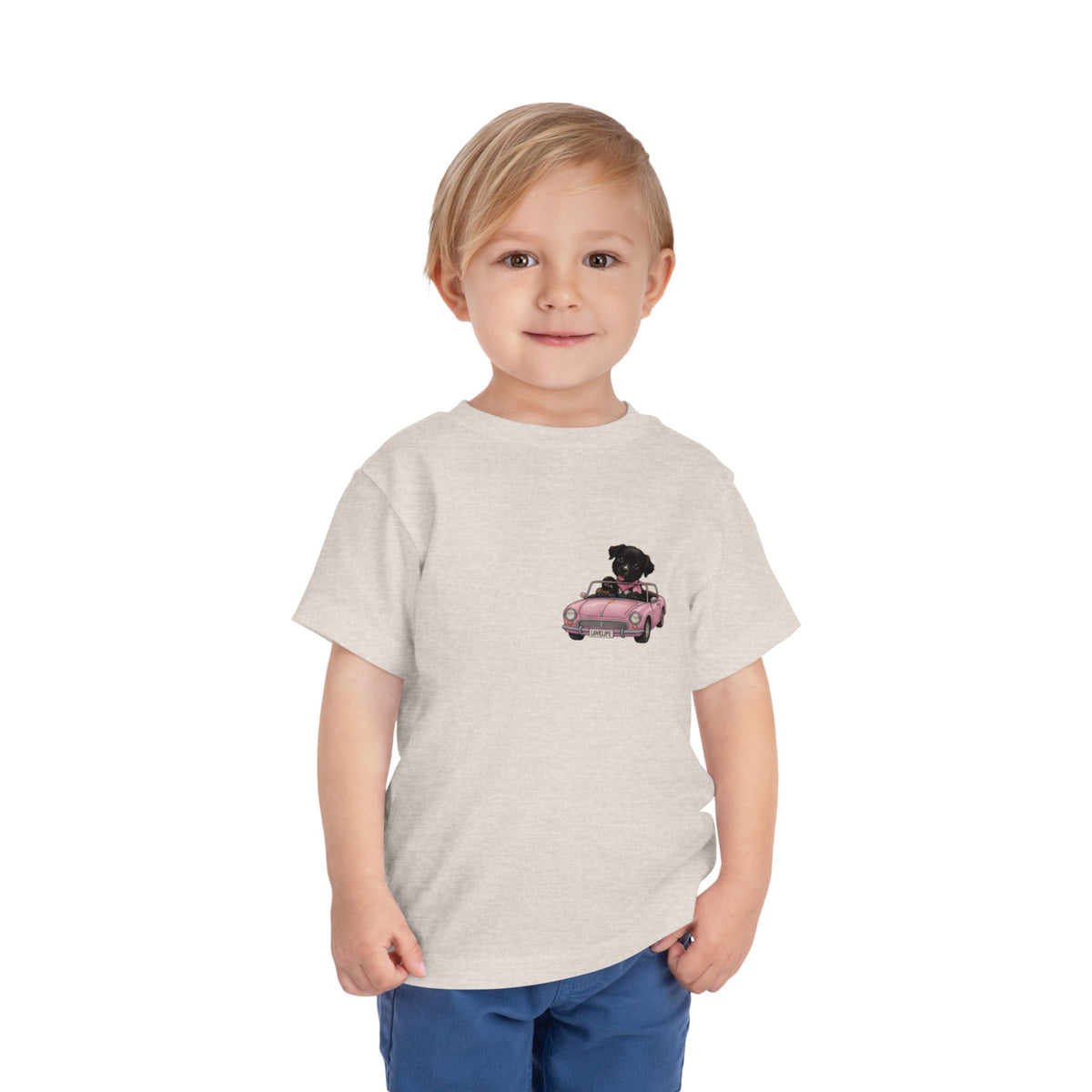 Toddler Tee — Cute Black Dog in Pink Car with "Dream. Believe. Love." Back Print