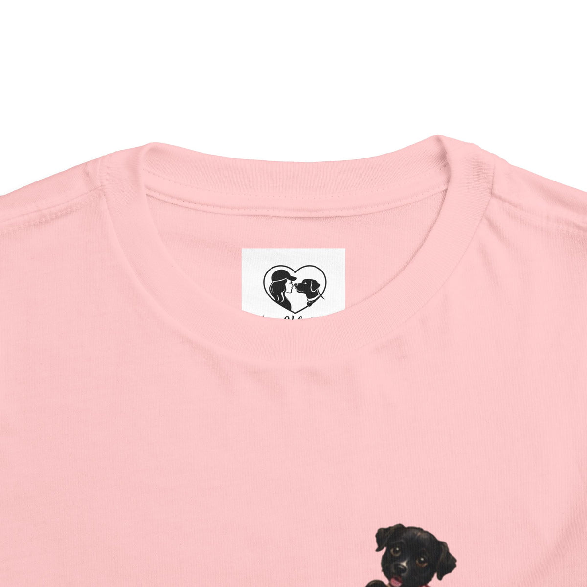 Toddler Tee — Cute Black Dog in Pink Car with "Dream. Believe. Love." Back Print