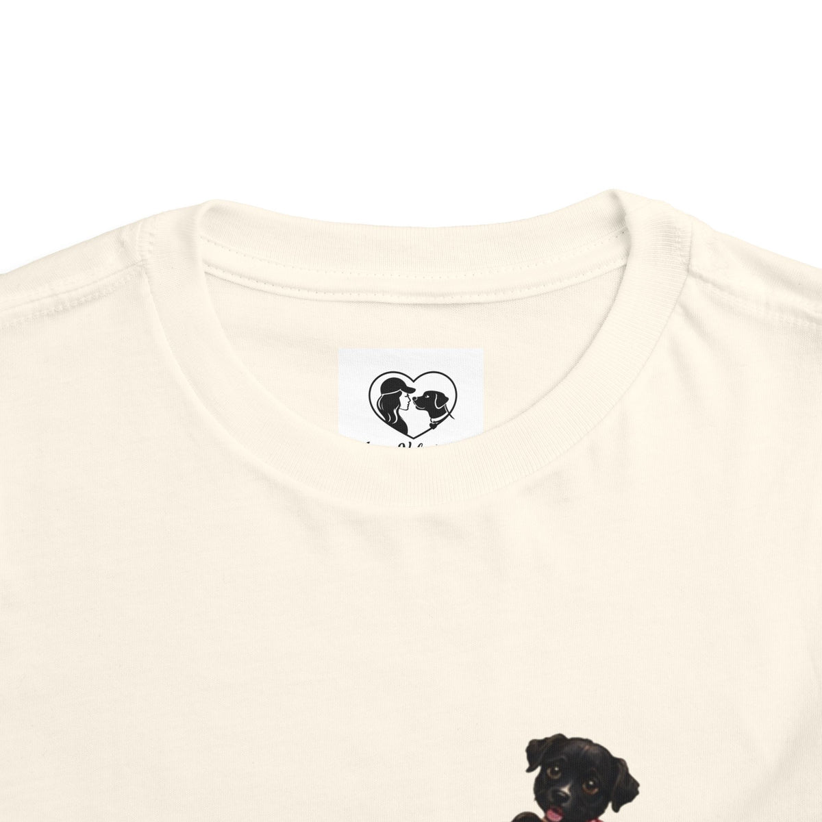 Toddler Tee — Cute Black Dog in Pink Car with "Dream. Believe. Love." Back Print