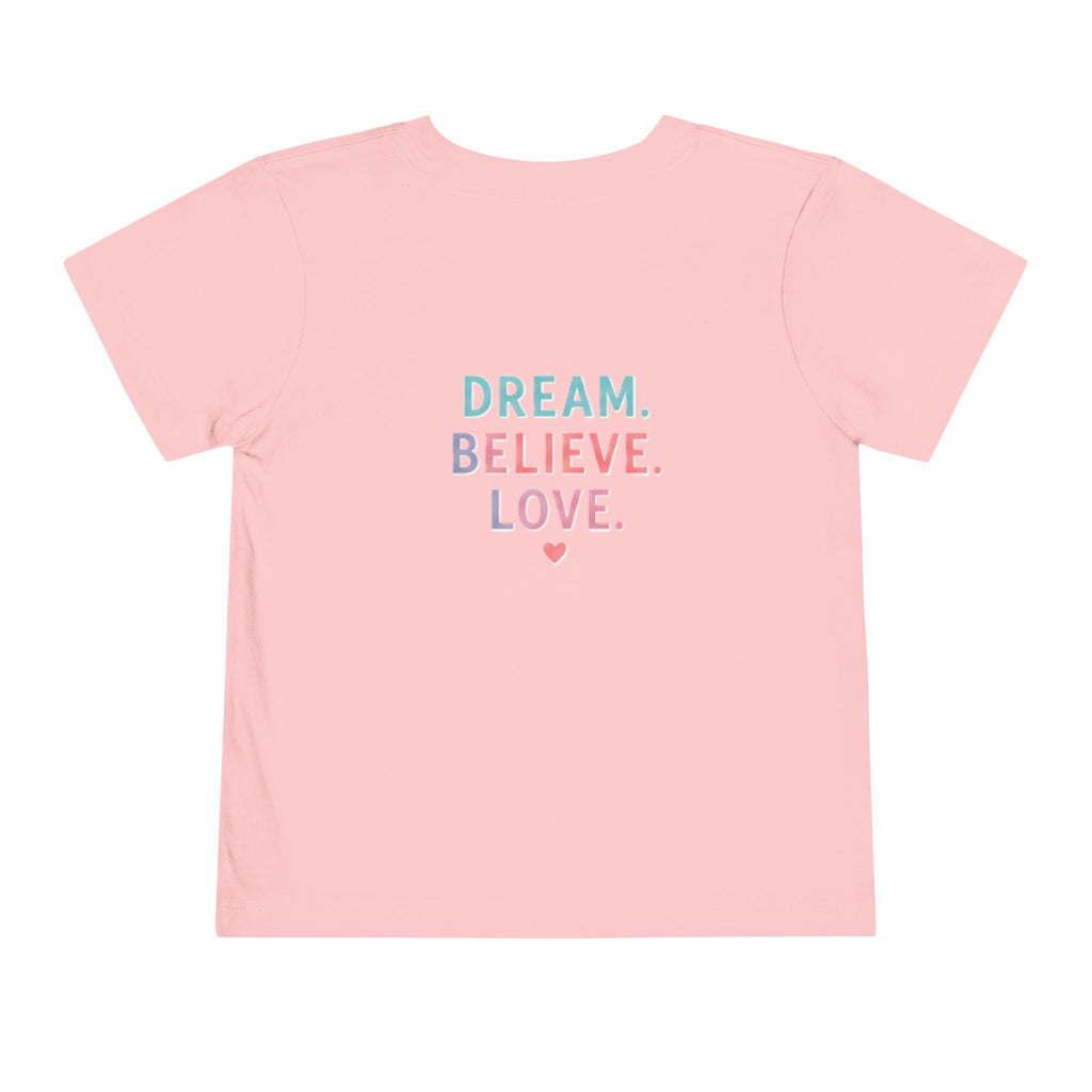 Toddler Tee — Cute Black Dog in Pink Car with "Dream. Believe. Love." Back Print