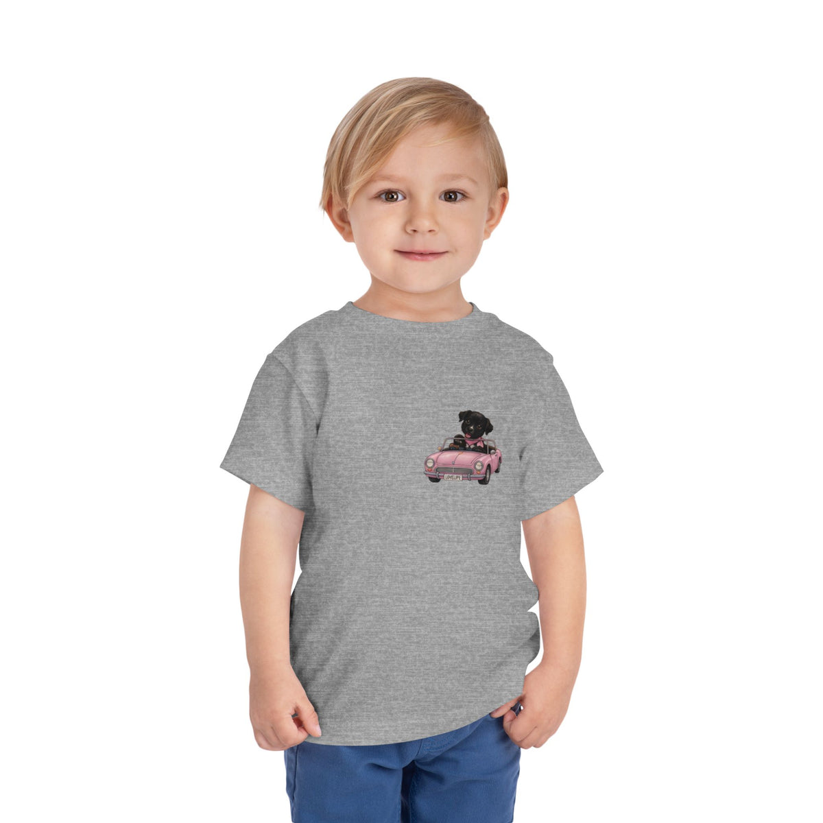 Toddler Tee — Cute Black Dog in Pink Car with "Dream. Believe. Love." Back Print
